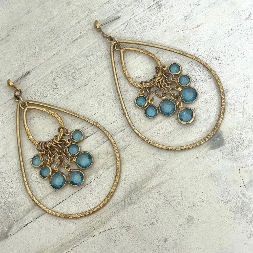 Gold tone statement earrings with blue rhinestones